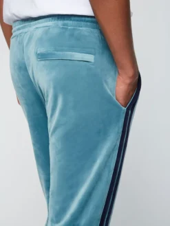 Hot Debossed Damarindo Velour Track Pant- Larkspur Pants And Sweatpants